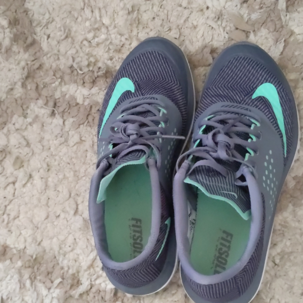 Grey and teal Nike fit sole